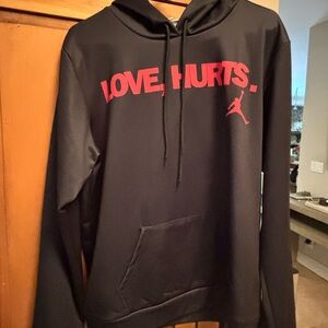 Black Hoodie with Red Graphic by [Brand]